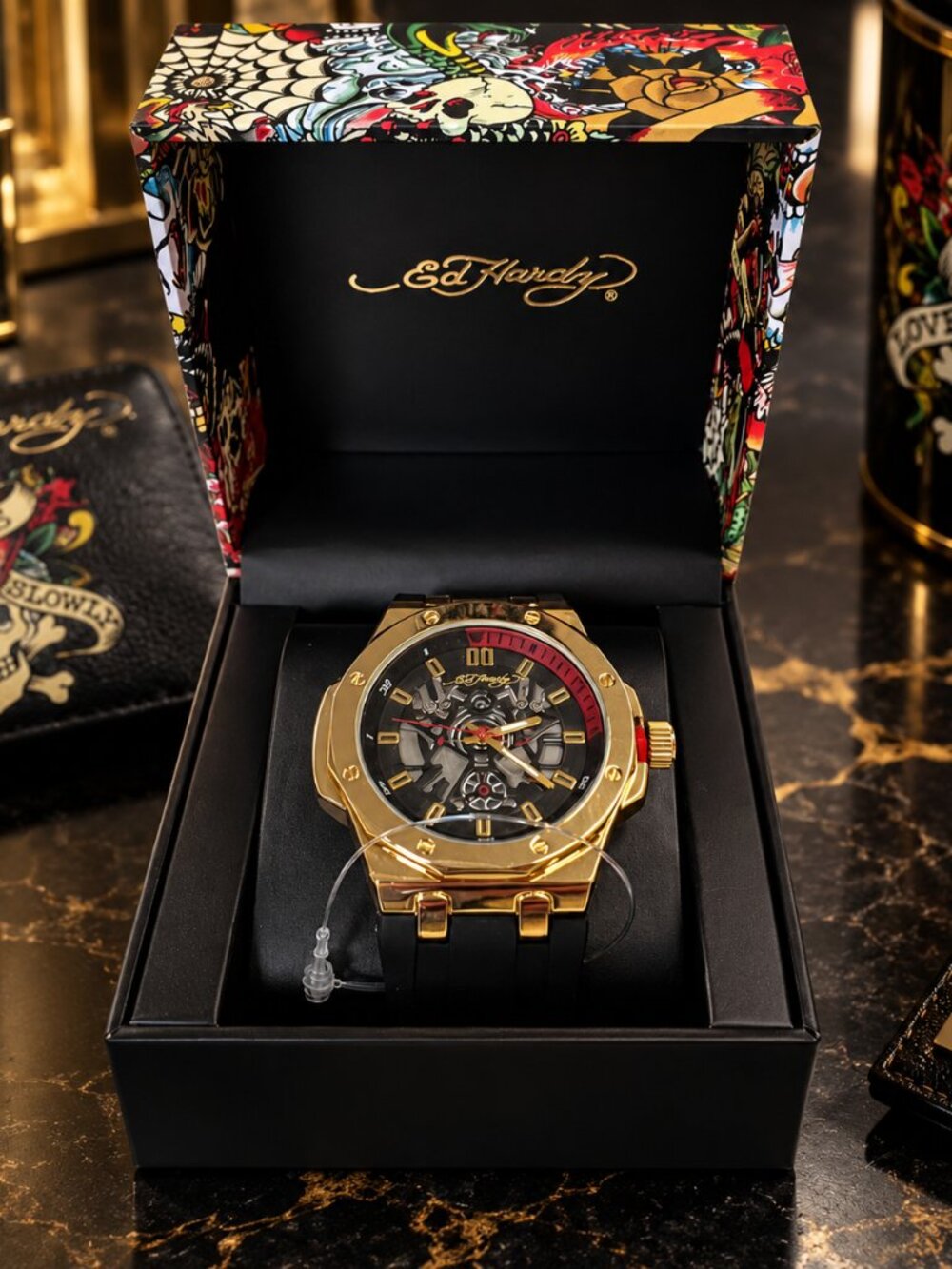 Ed Hardy men's sport wristwatch. Black rubber band. Gold case. Analog. Skeleton…